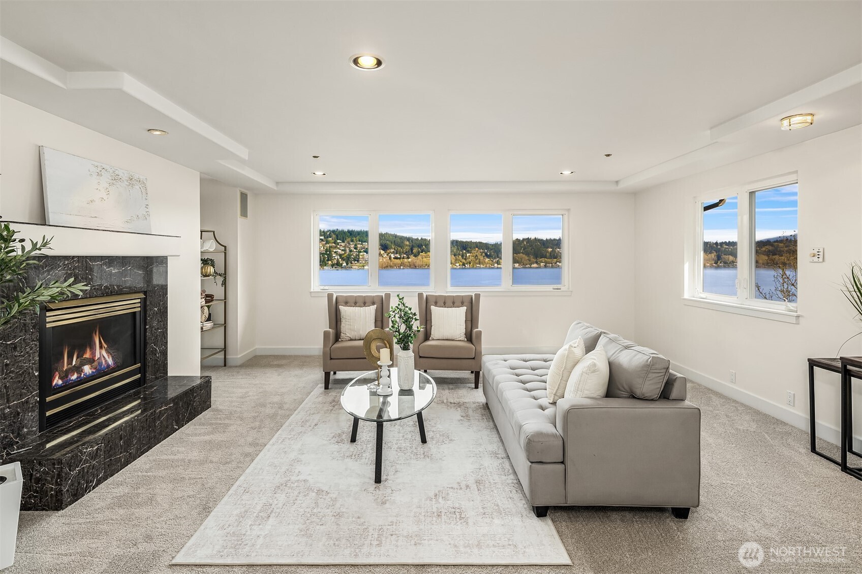 The sitting area in the main primary suite with a fireplace for comfort and ambiance. This room is plenty big enough to divide into two rooms to give three bedrooms upstairs. Or keep as is for a the most incredible private suite.