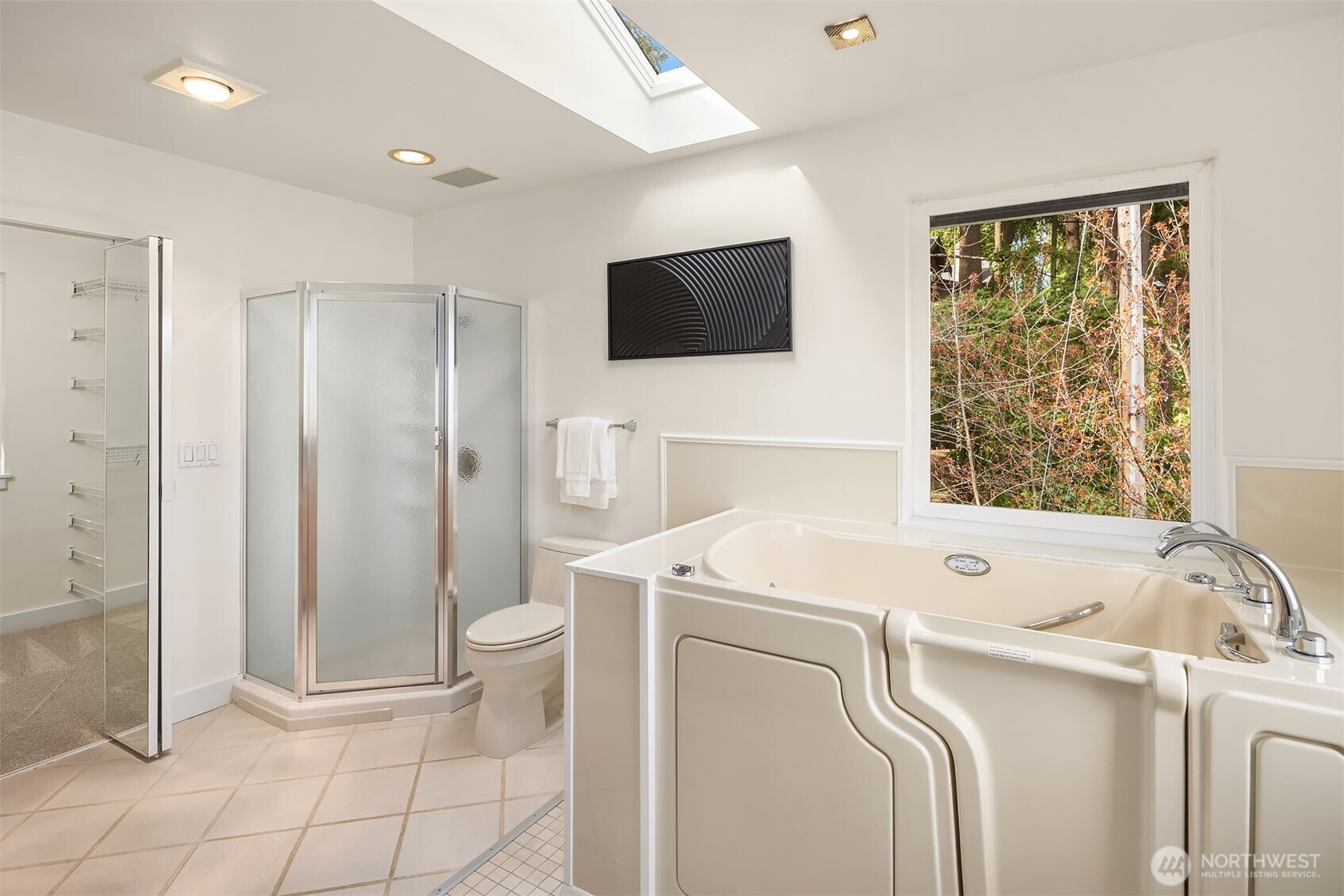 The lower level includes a rec room, second kitchen, and two further bedrooms, plus it's own private deck, with incredible lake views. With it's own entrance, can be used as an income producing apartment.