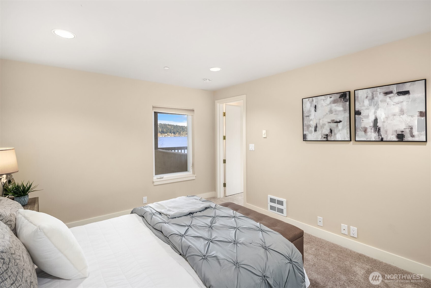 One of two bedrooms in the lower level, again with views of the lake. Enlarge the window for an even better lake view