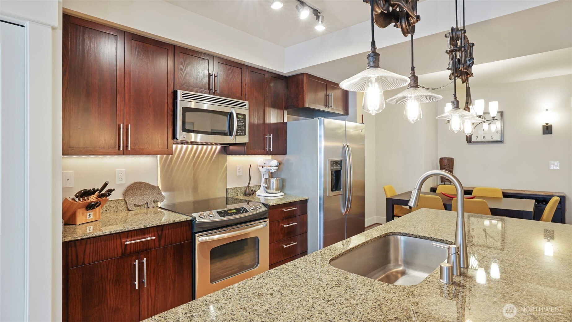 Center island kitchen with pantry and full size stainless steel appliances