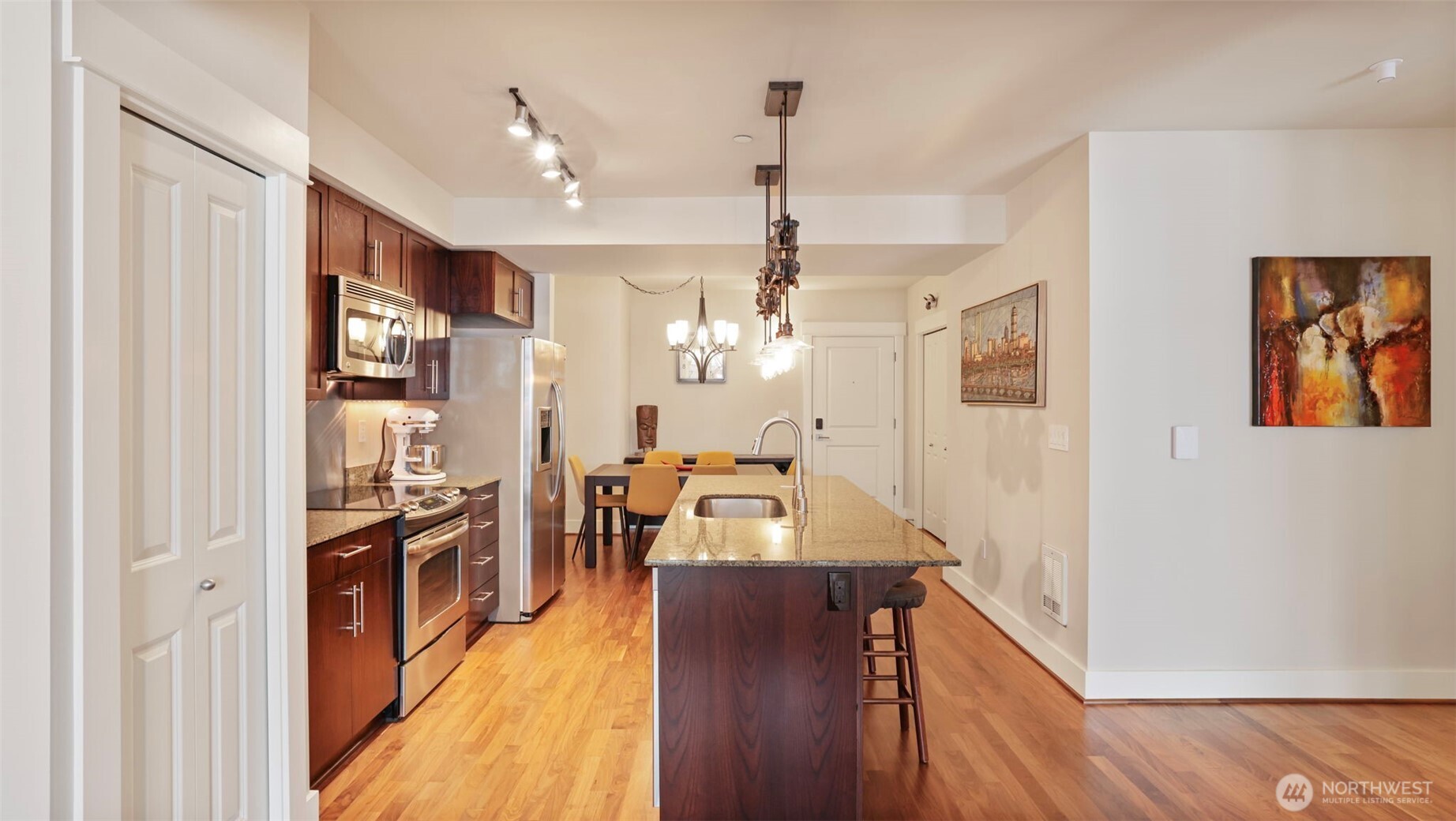 Center island kitchen with pantry and full size stainless steel appliances
