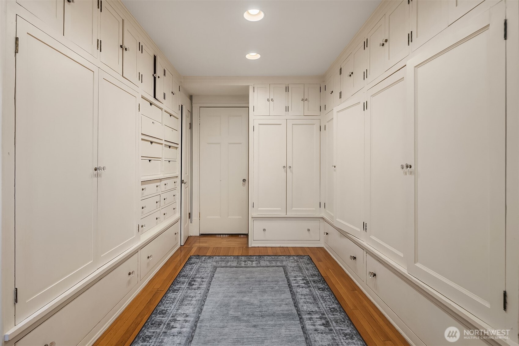 The primary suite walk-in closet (approximately 11 feet by 16 feet).