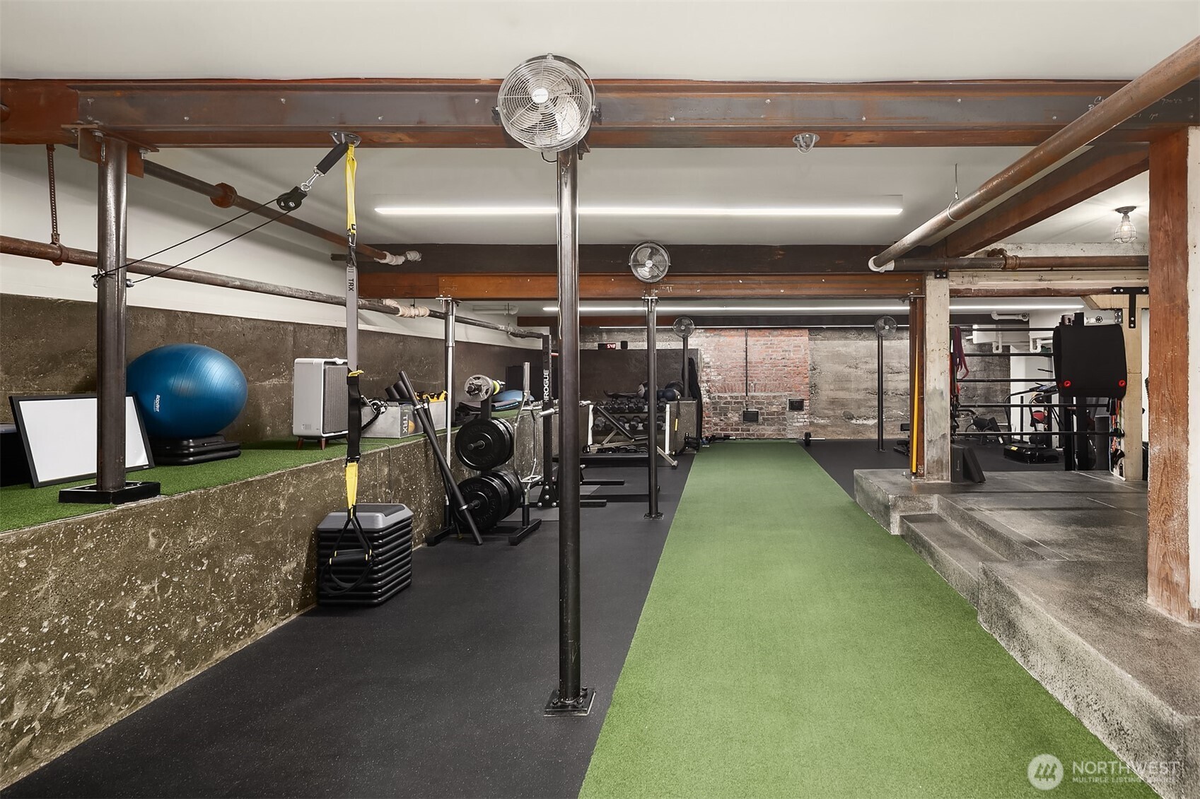 The lower level is currently used as the home gym complete with a sauna and three-quarter bath. The area is easily adaptable for multiple purposes.