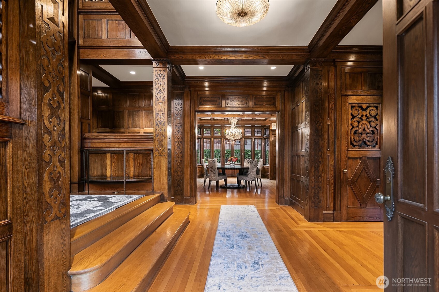 Hand carved Siberian Oak paneling graces the entry foyer, the dining room, the living room and the stairwell.
