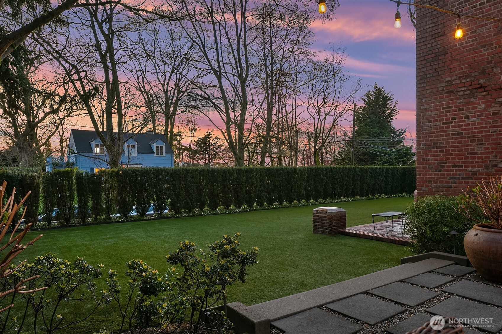 Another photo of the backyard. Note the large patio pavers.