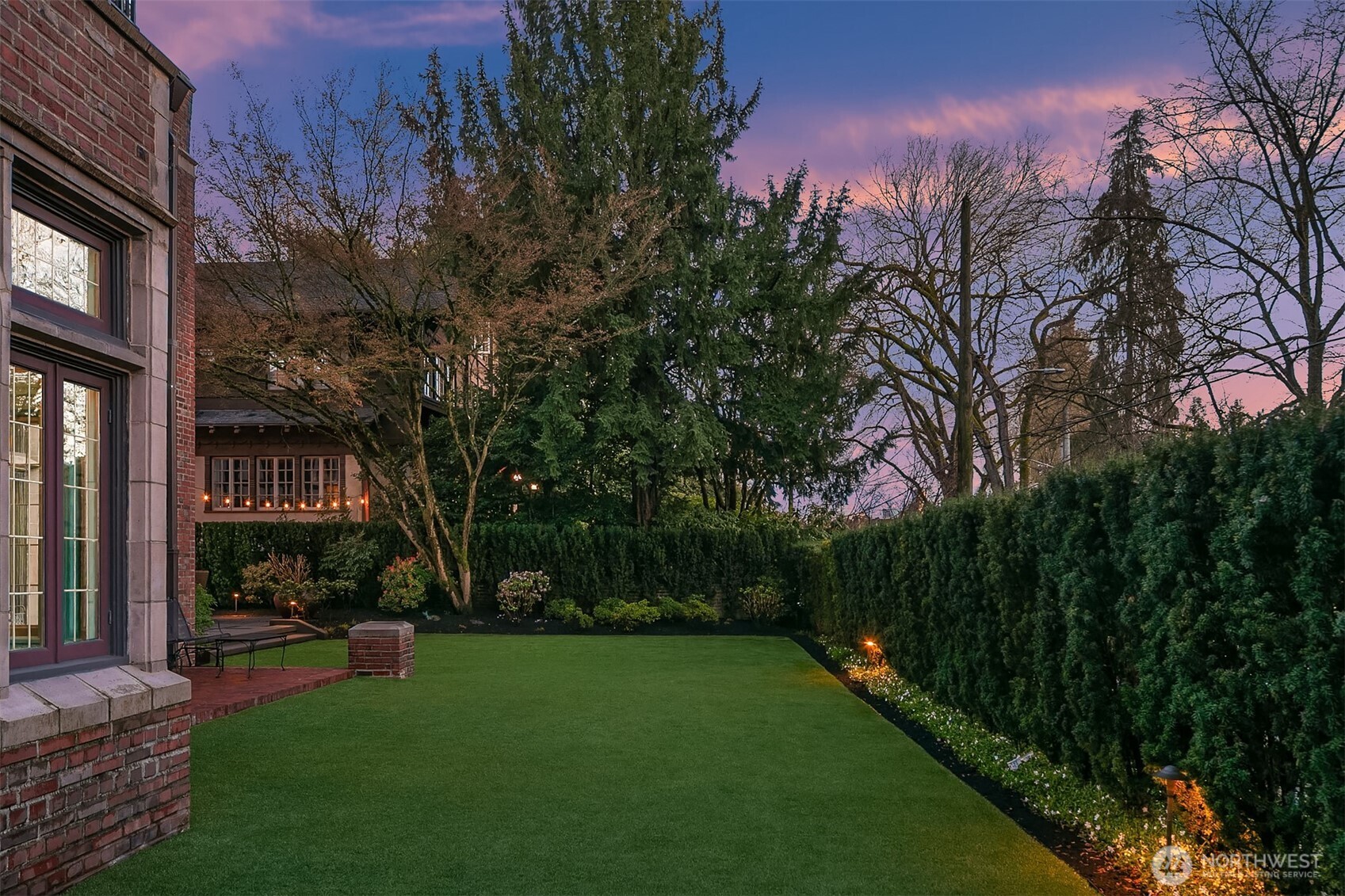 The lawn area extends along the entire West side of the property. The low maintenance turf lawn never needs mowing!