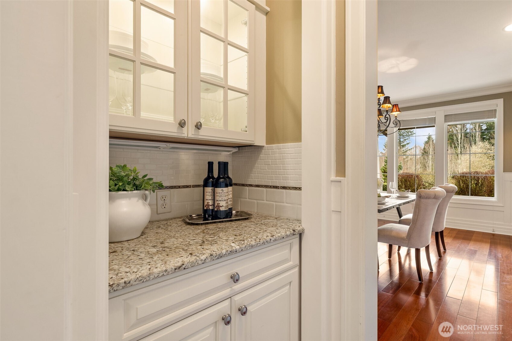 Butler's pantry between the kitchen and dining room. Great for extra storage.