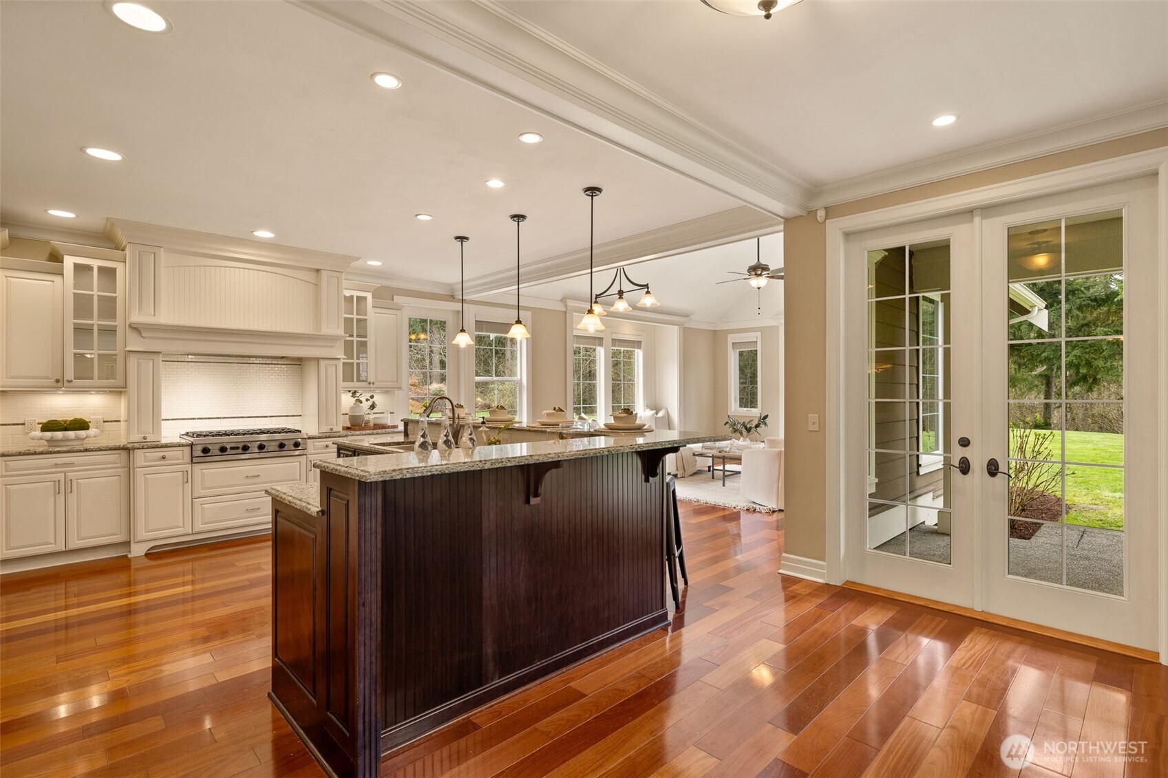 French doors to the back patio and a view of the family room.