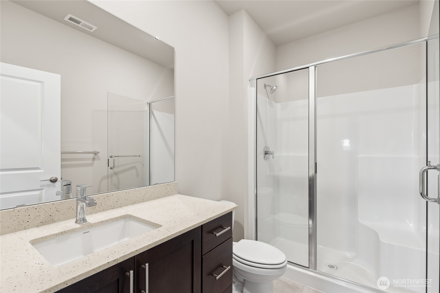 3/4 bath on main level adjacent to bedroom or home office.  Home for sale will include white cabinetry.