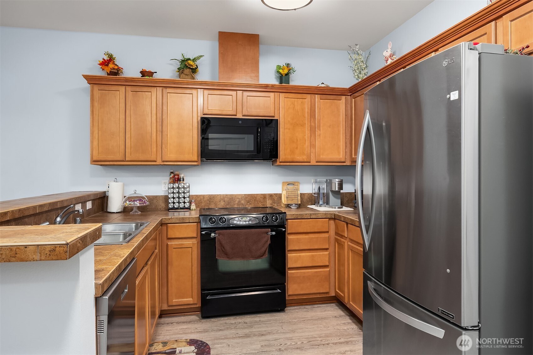 Kitchen features a full size pantry on the opposite wall.