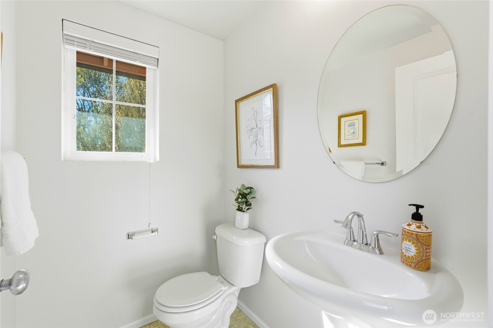 Half bathroom off of the kitchen & dining spaces.