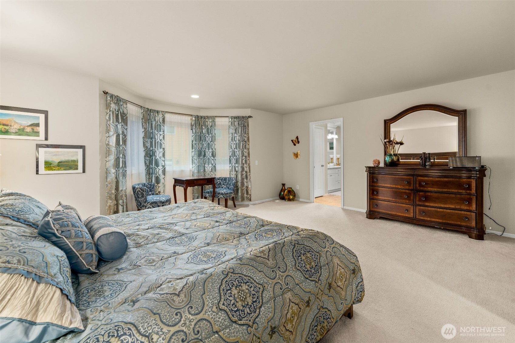 Sumptuous primary bedroom with a spa-style 5-piece primary bathroom and a huge walk-in closet
