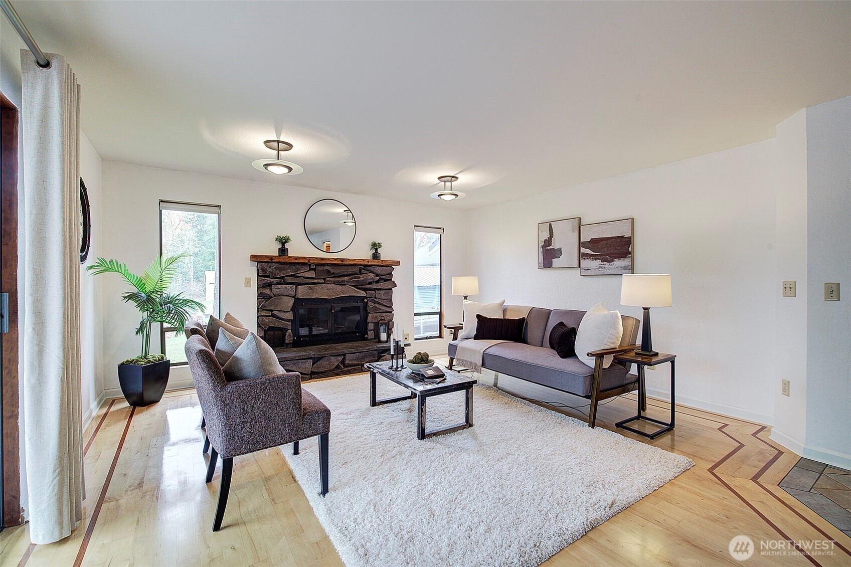 The family room features a cozy fireplace - offering a warm and inviting place to relax.