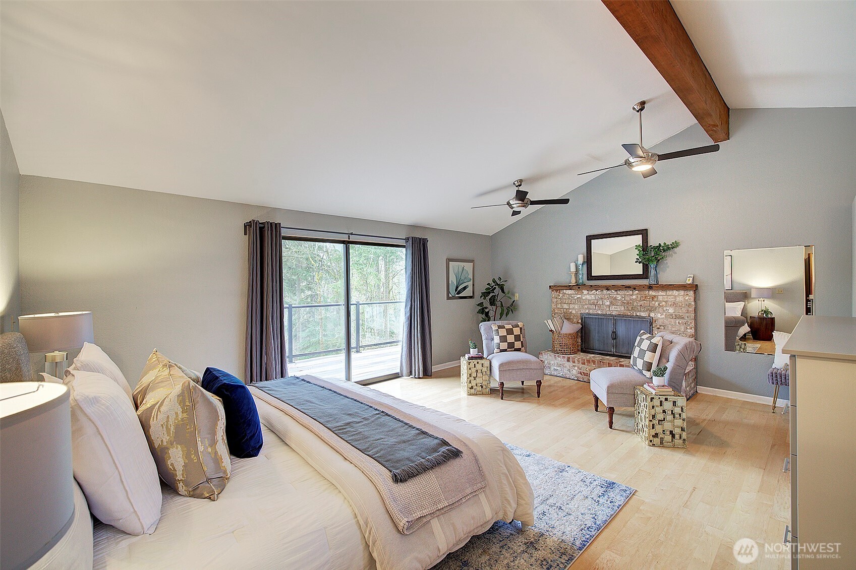 Upstairs, the impressive Primary Ensuite serves as a private retreat with its own fireplace, vaulted ceilings, hardwood floors, and an open-concept closet.