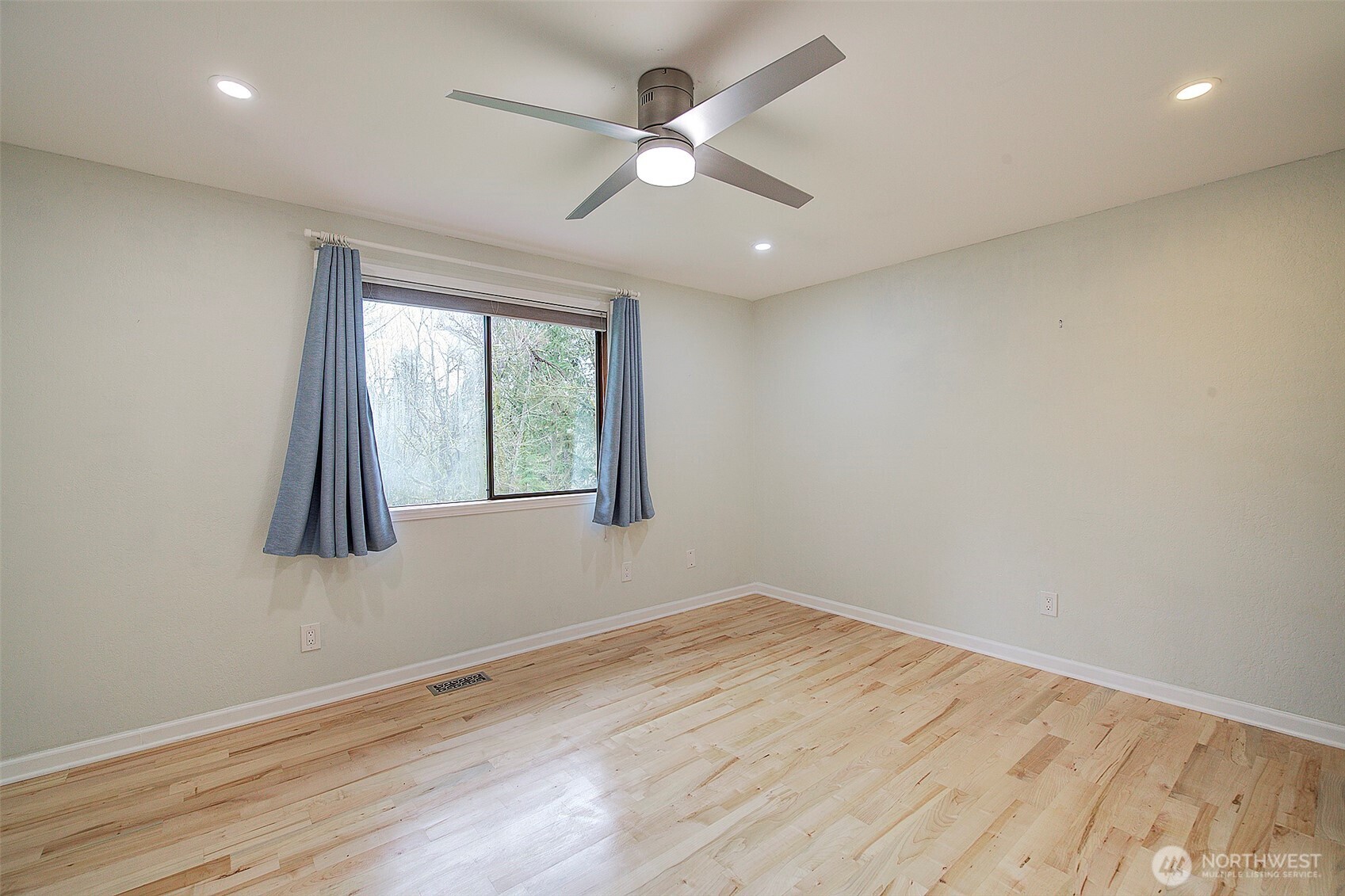 Bedroom #3 - same size as #2 bedroom. Both feature hardwood floors.