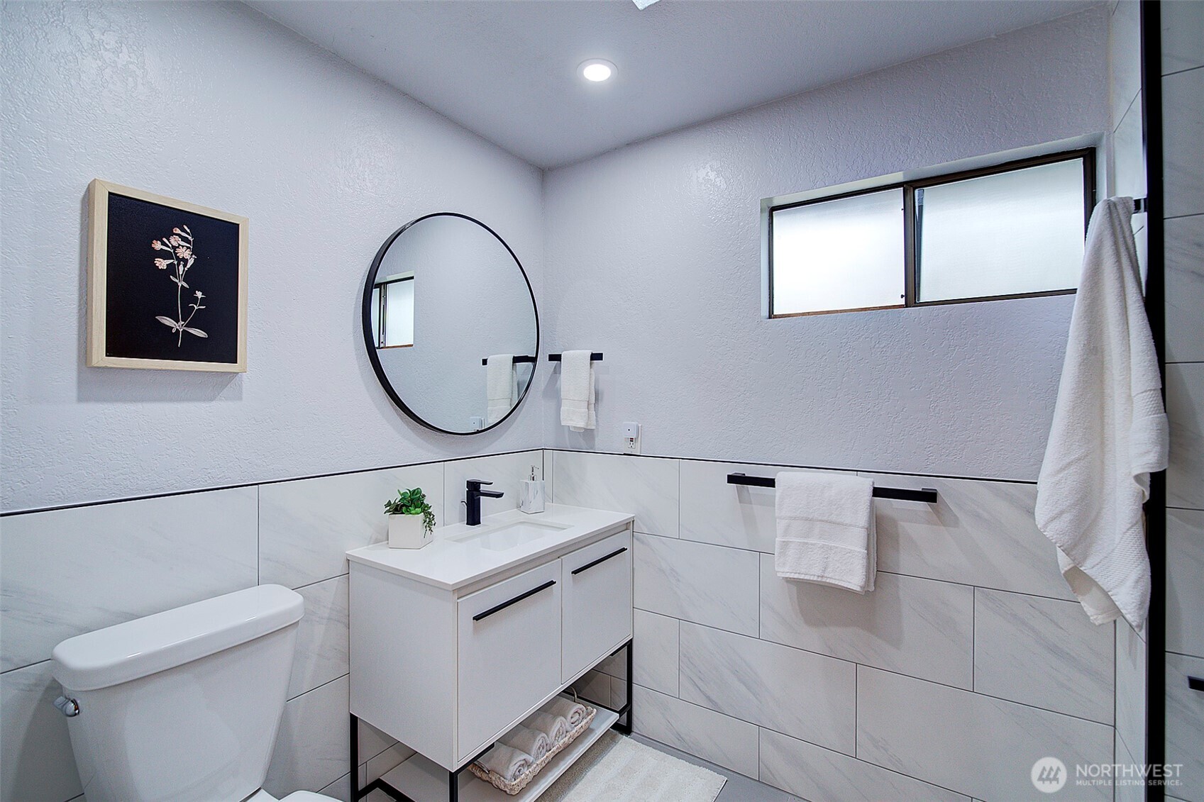 An additional bathroom is featured on the upper floor for the secondary bedrooms.  It's also been updated.