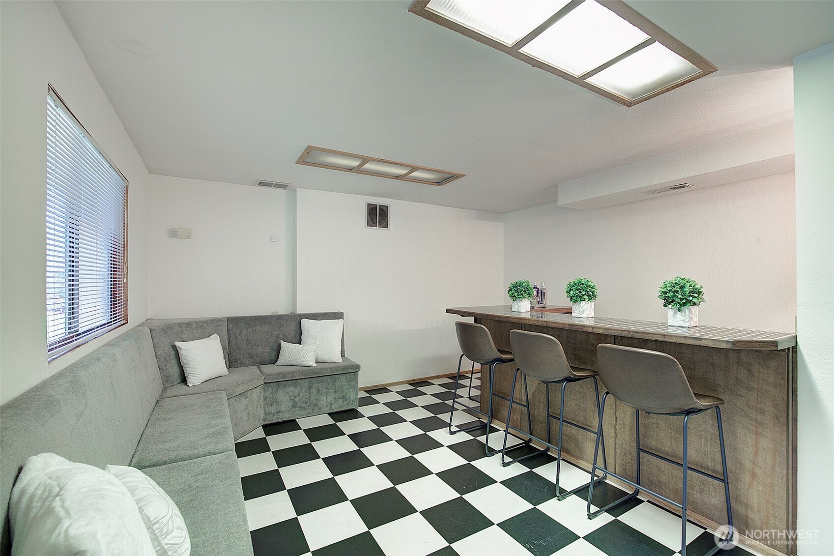 Built in benches offer storage space and the wet bar area feature bar stool seating.  Get your big screen TV mounted and you're ready to entertain!