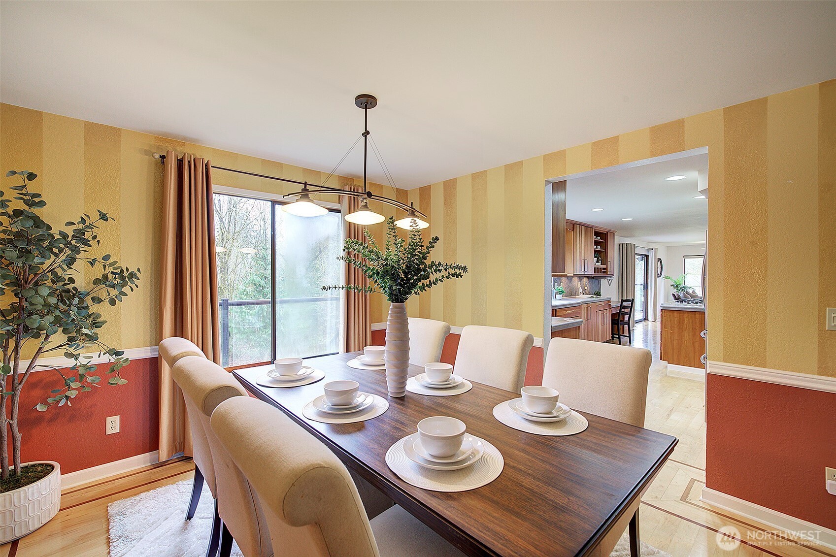 The dining room, located just off the kitchen can easily accommodate a formal table for 8 -10 guests.