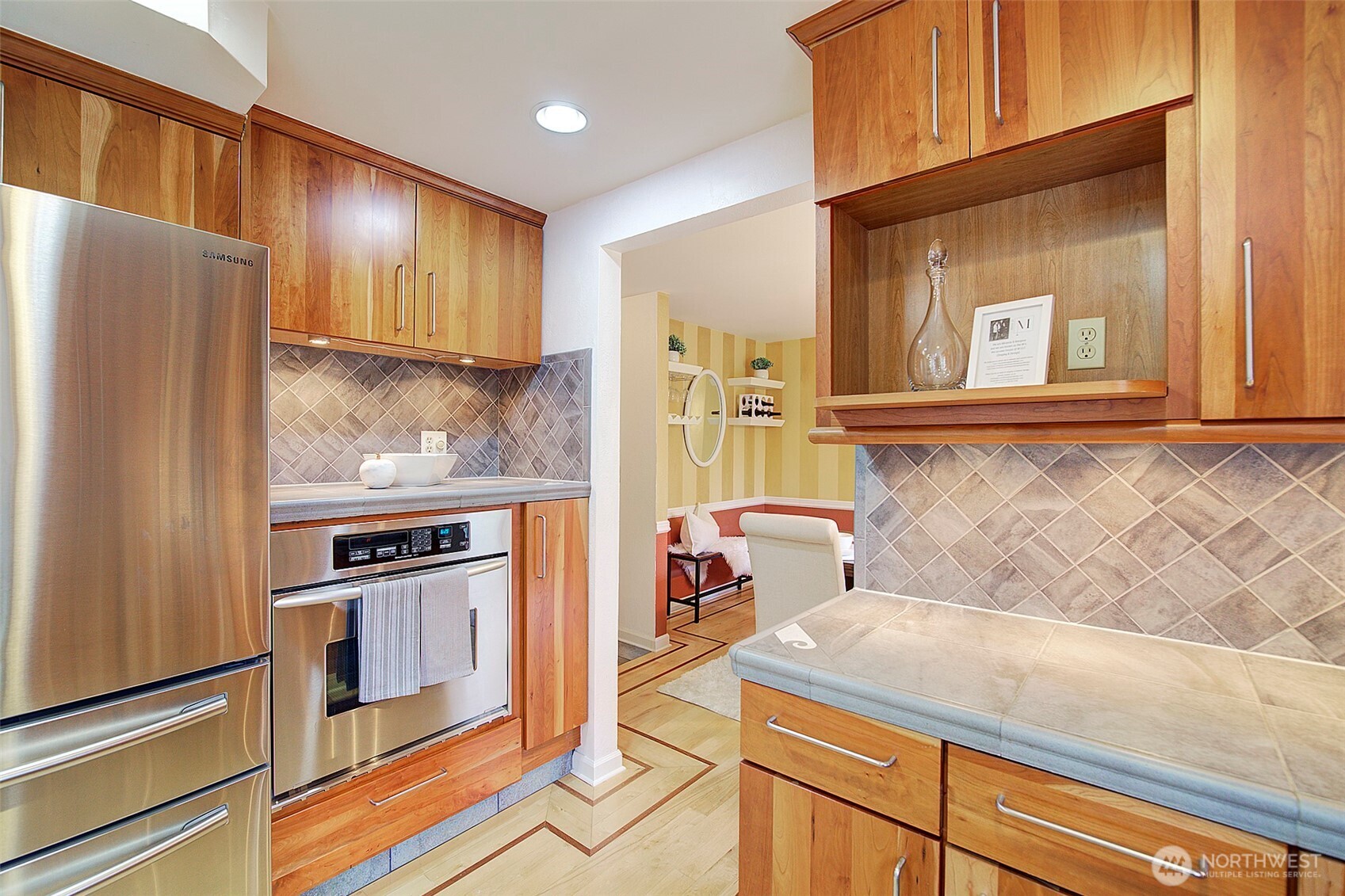The niche above the stove is the perfect place for a coffee bar. A built in microwave shelf is also featured.