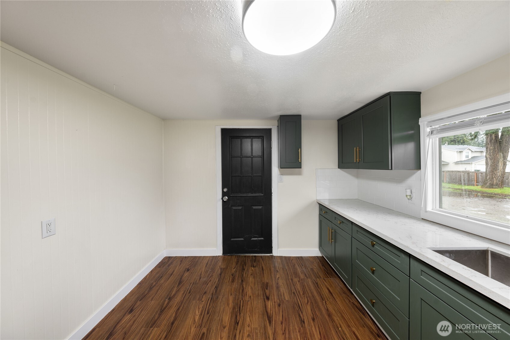 Updated bathroom with modern finishes and glass shower and tub