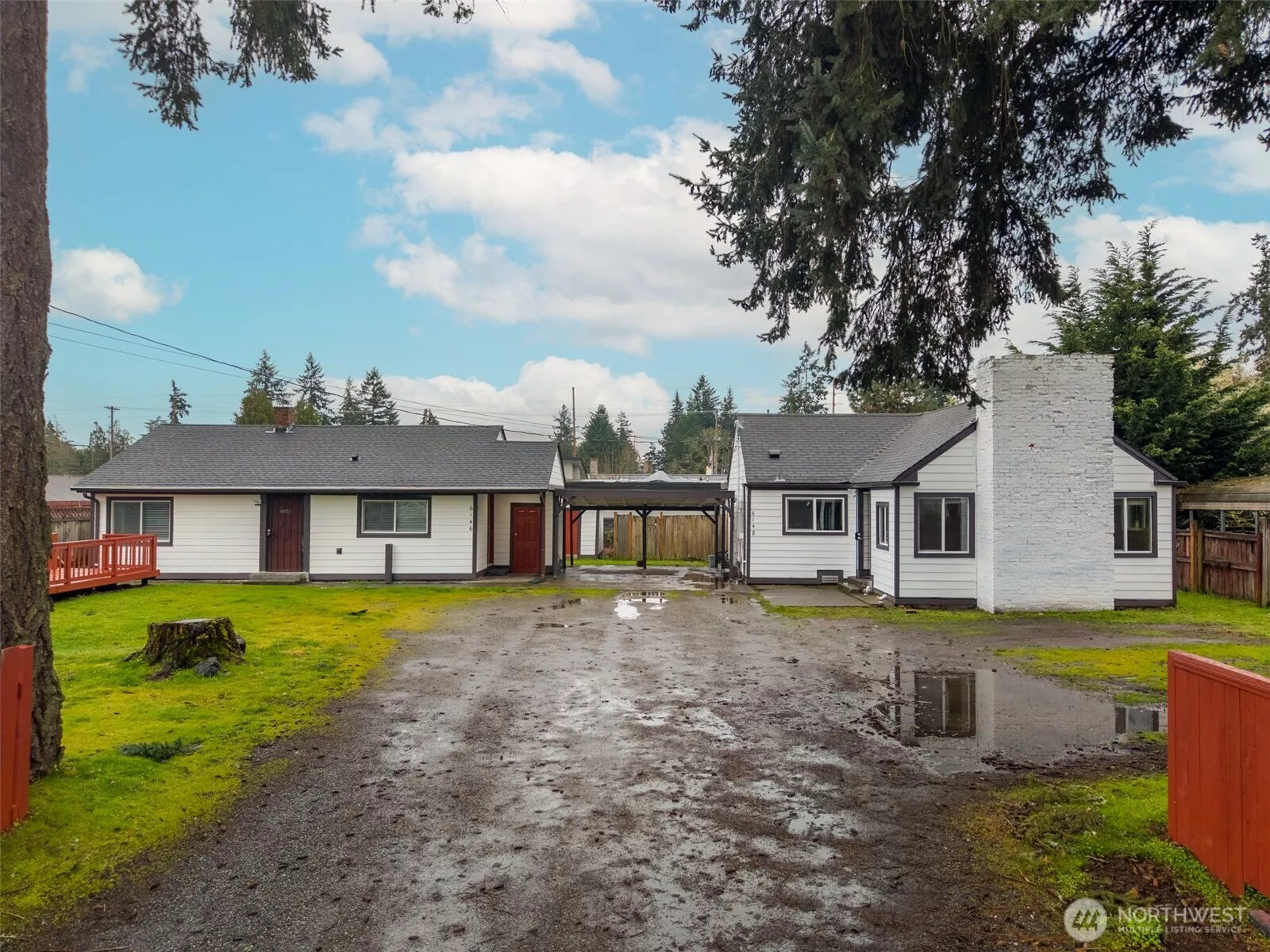 Renovated exterior angle highlighting upgrades and covered carport