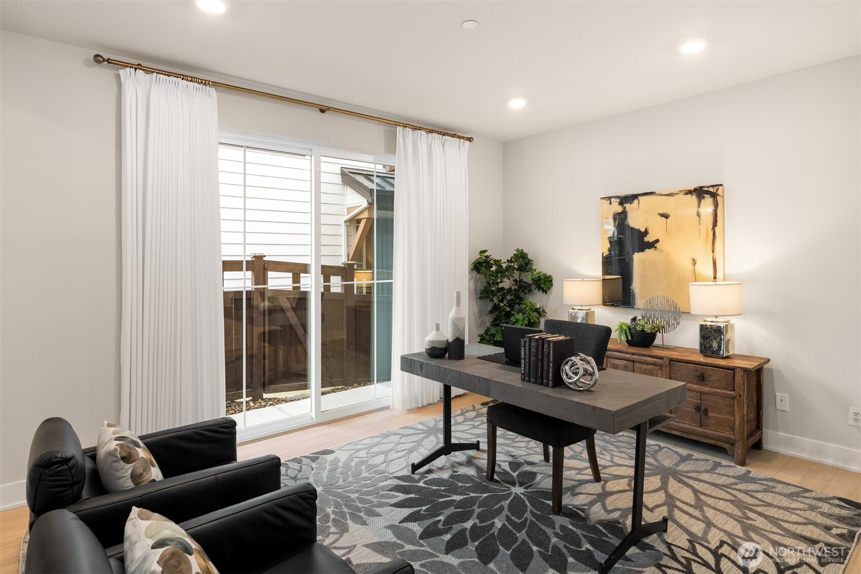 Versatile lower-level room ideal for a home office, gym, or media space.