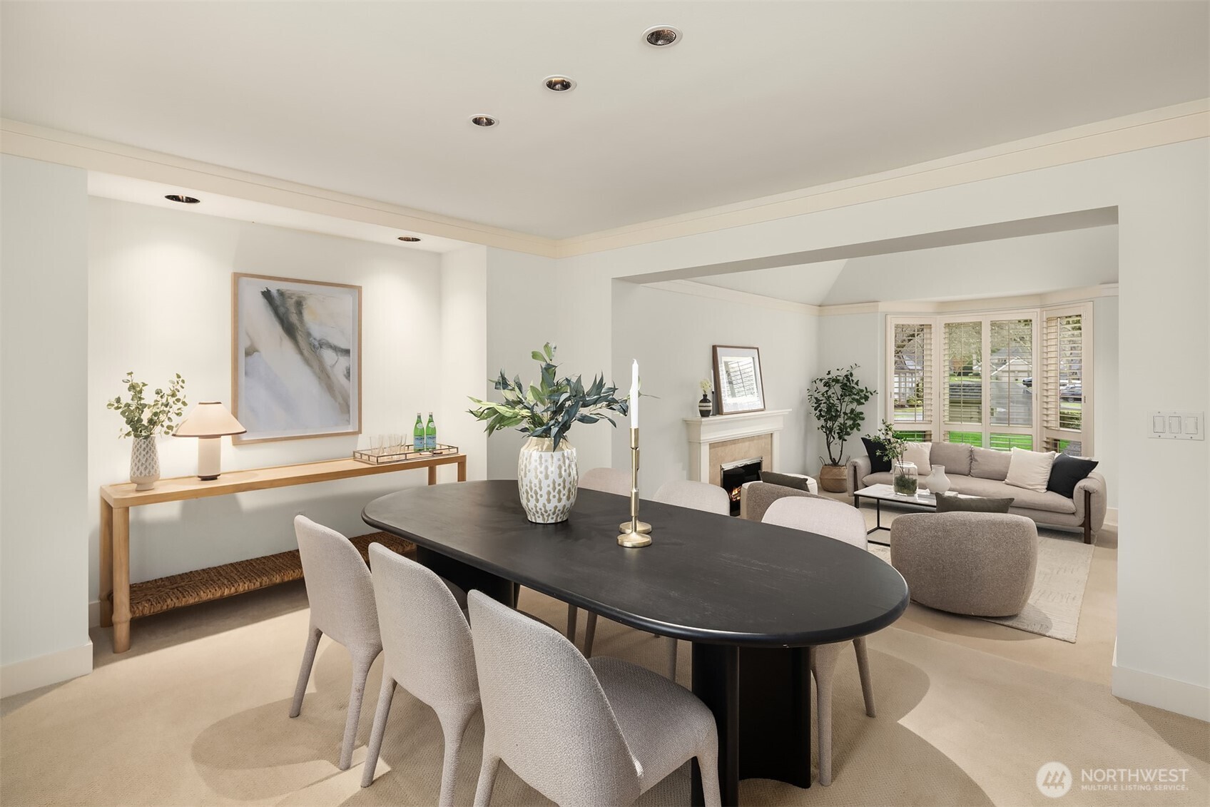 The main level flows effortlessly from the living and dining areas to the well-appointed kitchen, ideal for both everyday living and entertaining.