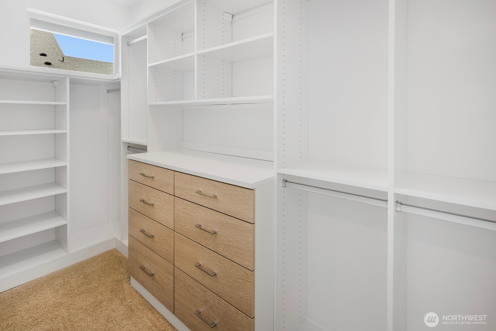 Primary suite has large walk-in closet with premium California Closets storage system. Every closet has been upgraded with California Closets.
