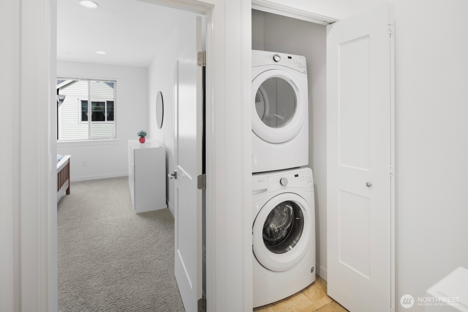 Laundry conveniently located on the upper floor.