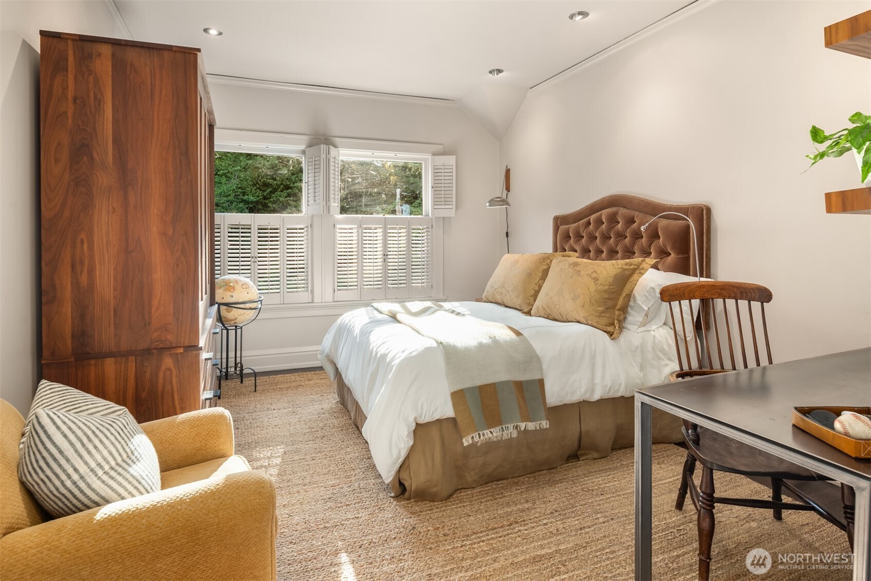 Guest bedroom with spacious closet storage.