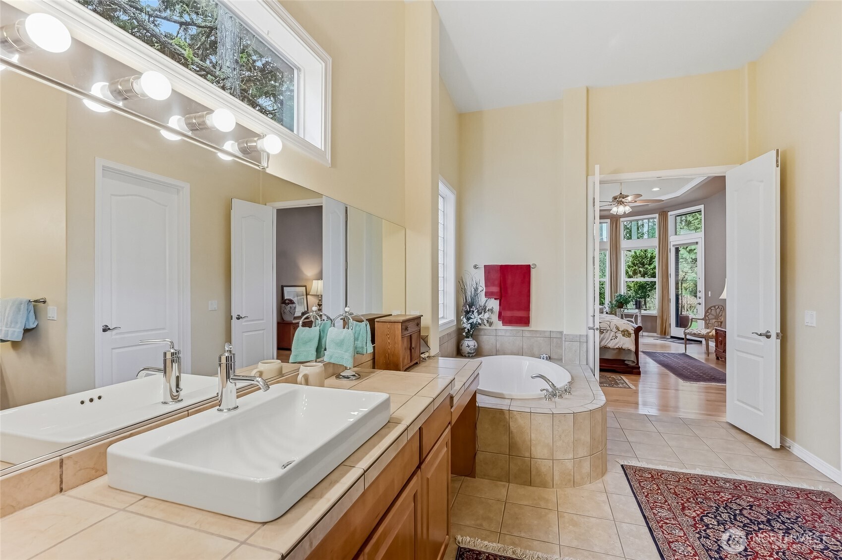 The second primary bedroom on the main floor is very spacious, has a walk-in closet, and, the cabinet has plumbing so this could be made into a studio apartment for extended guests.