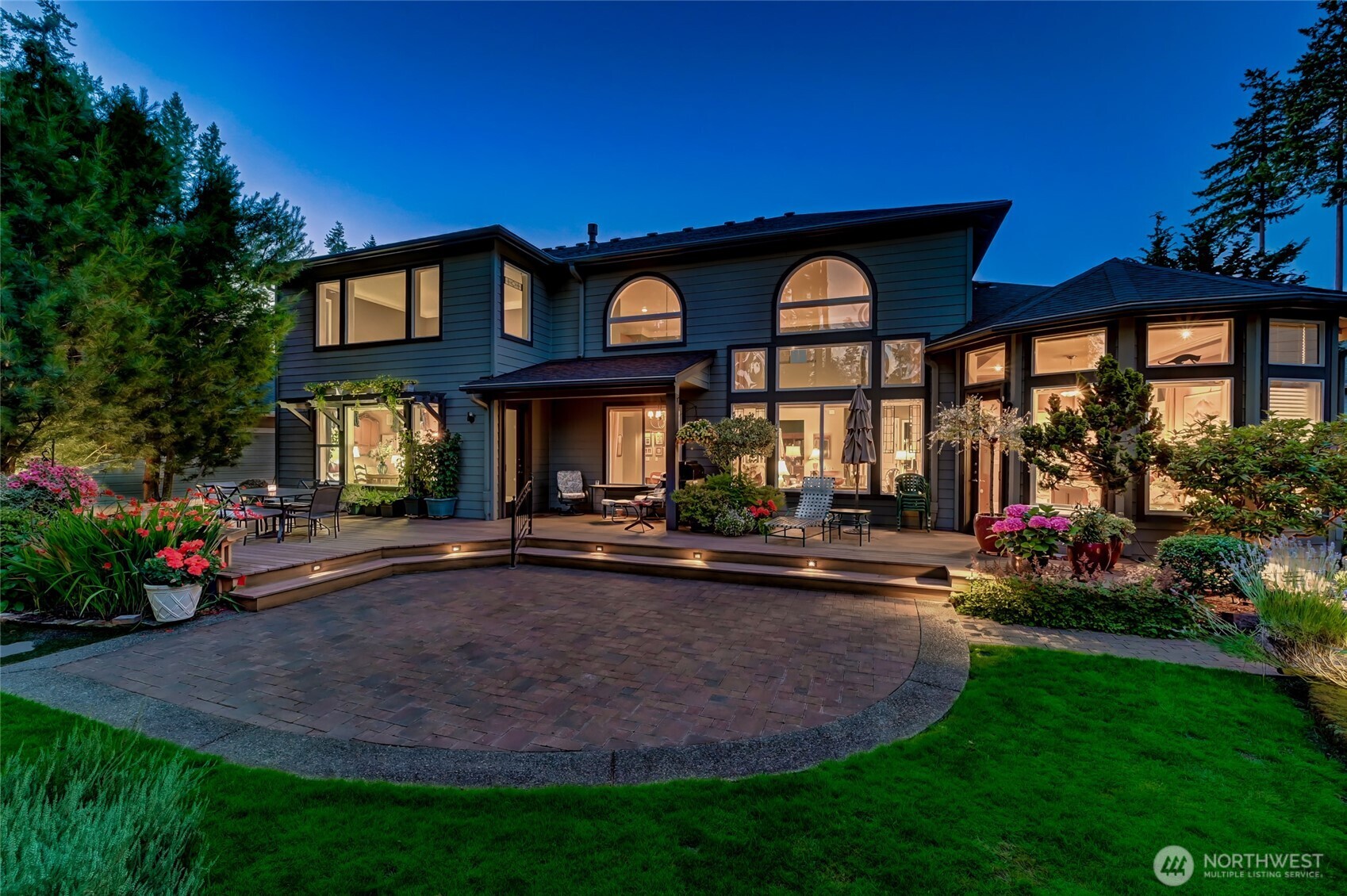 Looking back at the house really shows all the windows in the home that look out to the yard and the high ceilings that give the home such a spacious feeling.