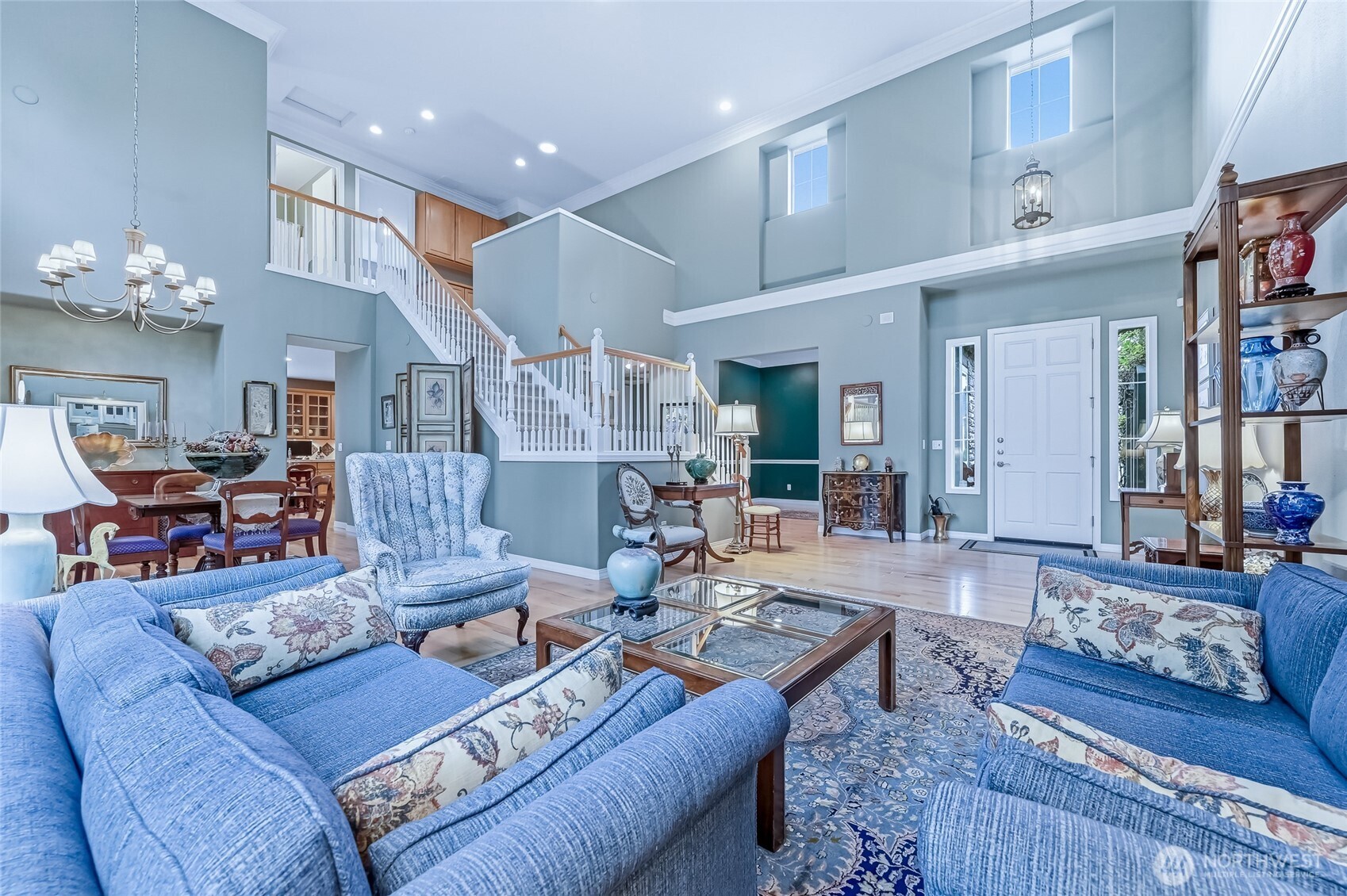 The formal dining room has a niche for a buffet or display hutch. The hallway leads into the kitchen and family room.