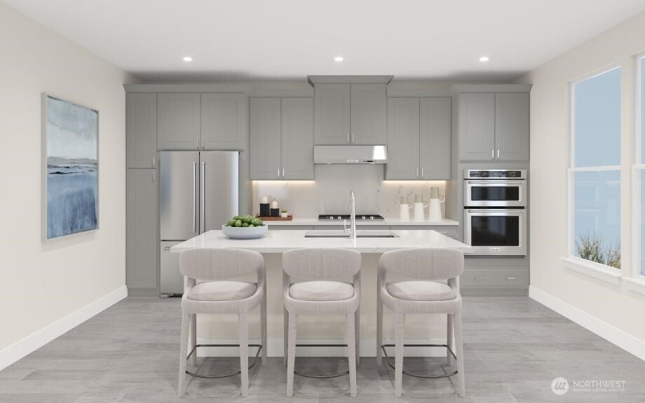 Well designed kitchen with gas cooktop, plenty of cabinets and walk in pantry