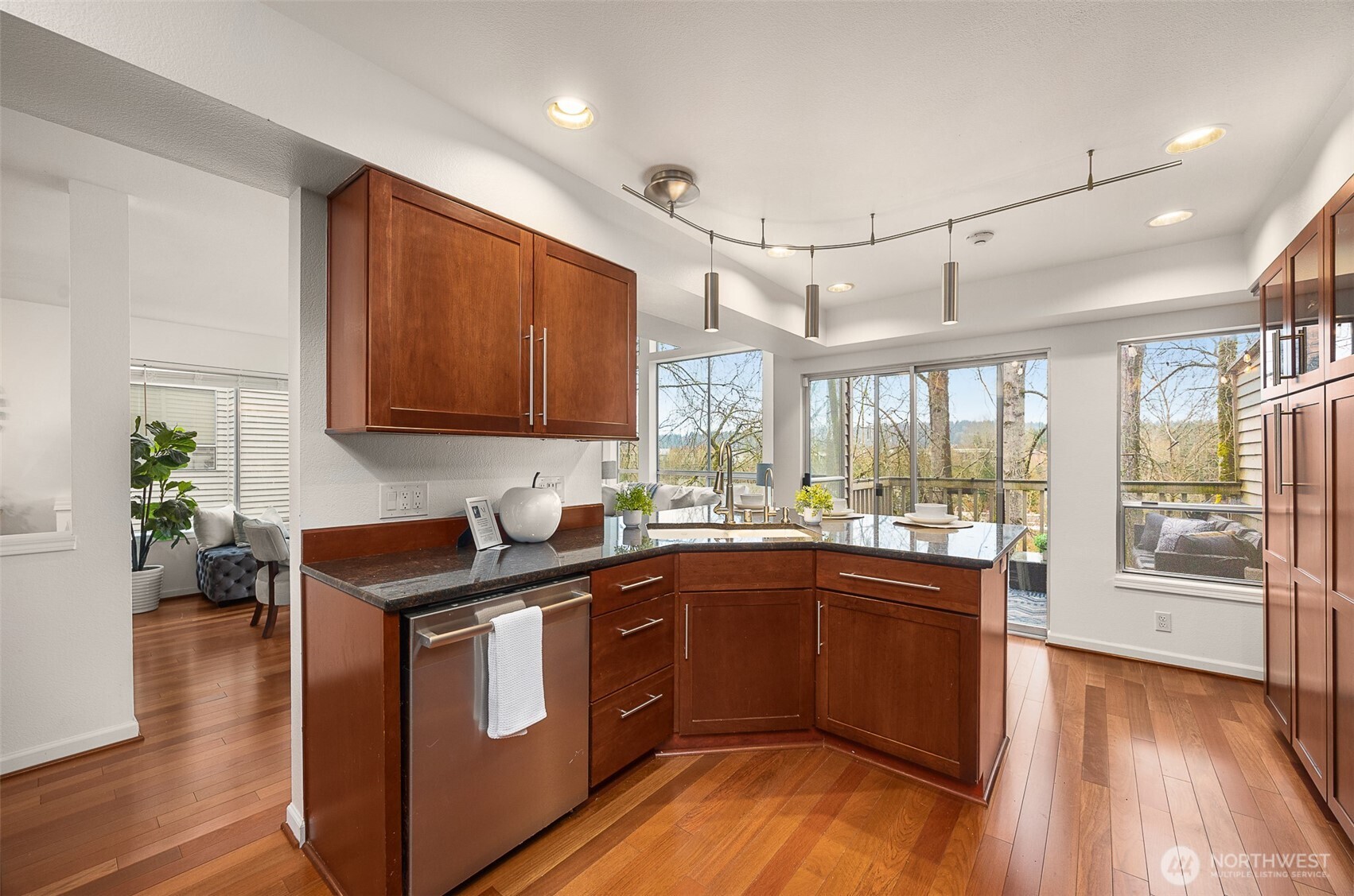 Kitchen maintains a chef triangle and plenty of cabinetry for pantry space