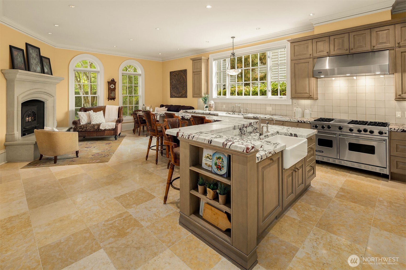 The kitchen opens to a breakfast area and cozy fireside sitting area.