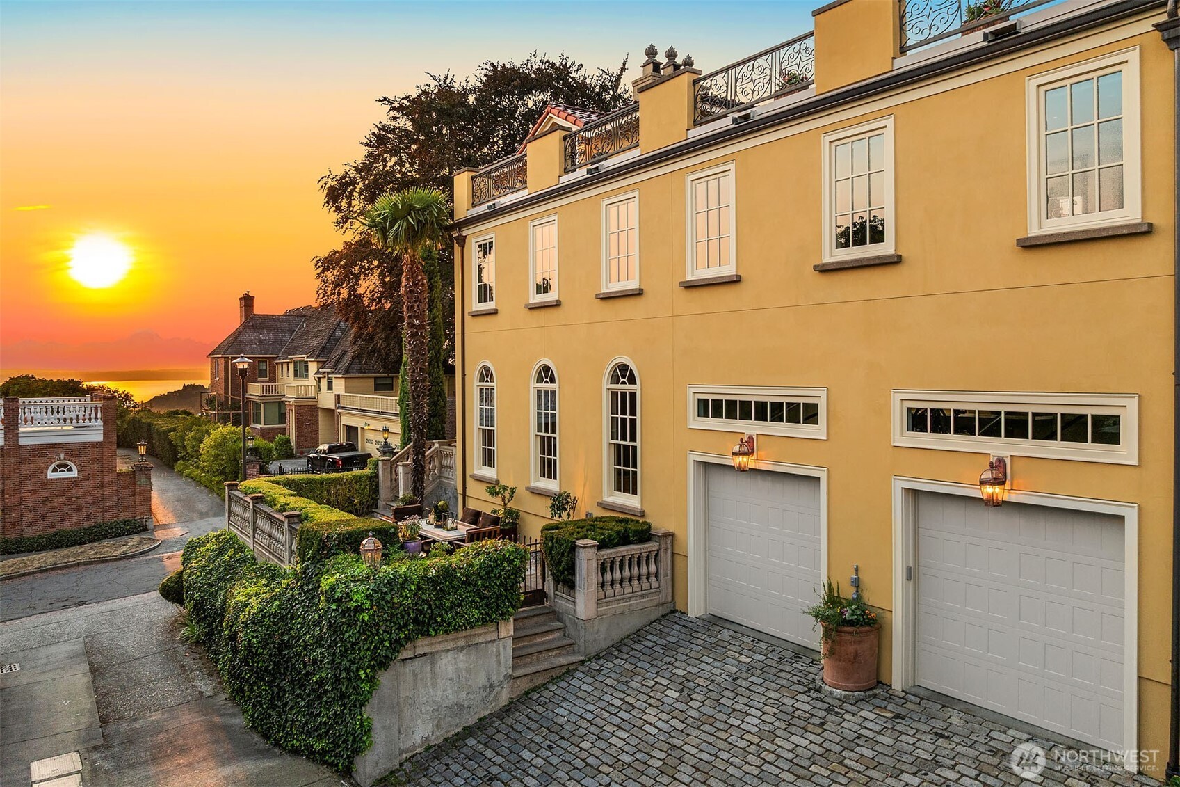 South exterior of home – enjoy alfresco dining and relaxation on the terraced back patio. Two-car garage with electric vehicle charging outlet.