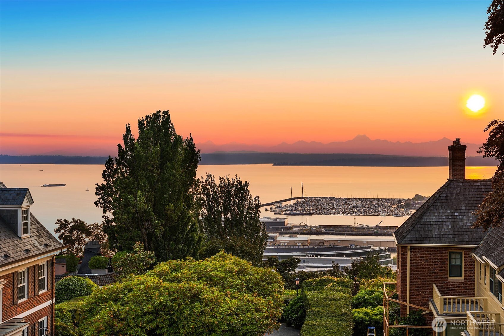 West-facing view from the rooftop deck of Elliott Bay, Elliott Bay Marina, and the Olympic Mountains.