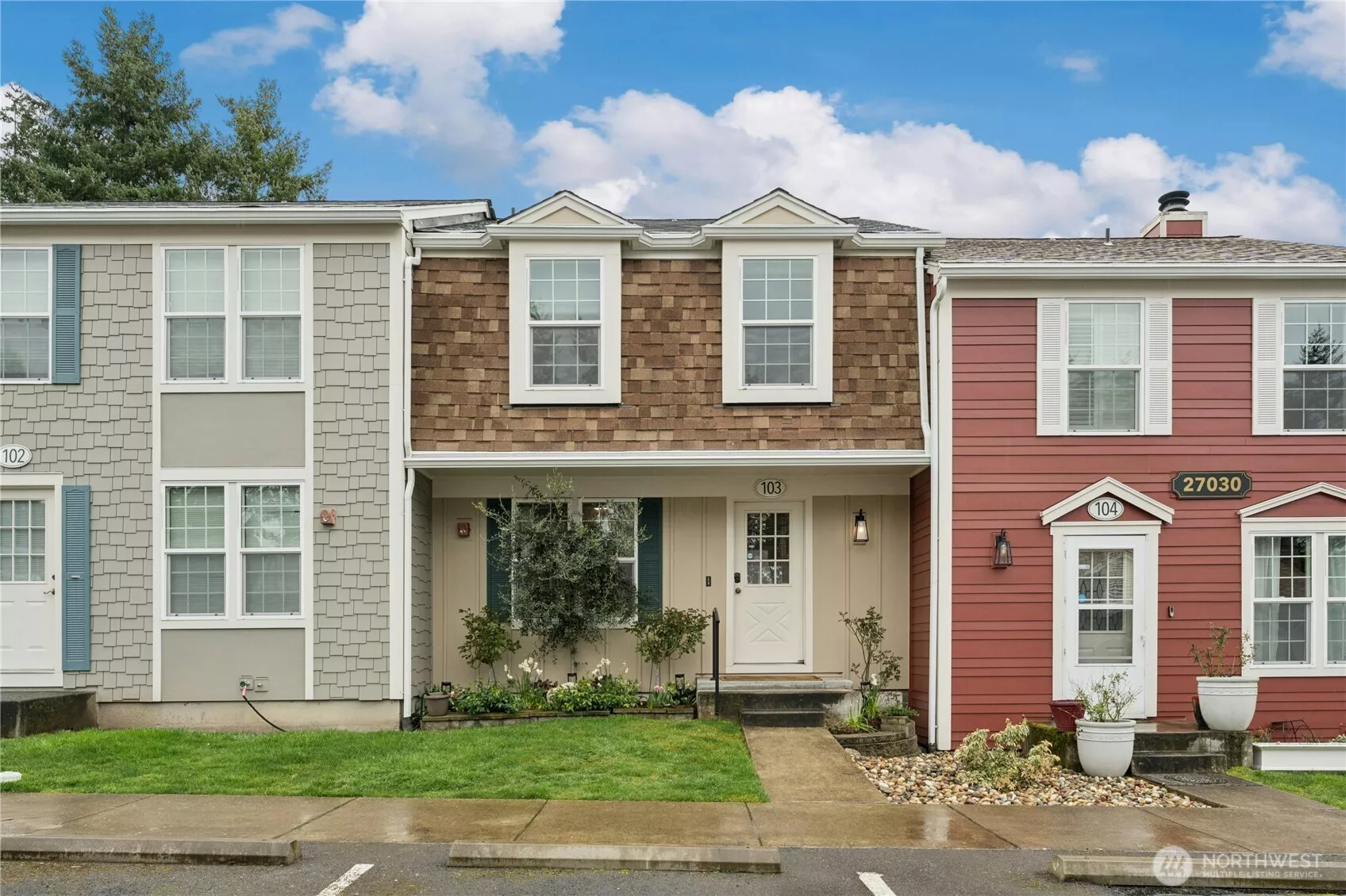 Carriage Row-One of the most unique condominium complex's.  Townhome-style. This unit is 3 level with a total of 1588 sf. 3 bedrooms upstairs with full bath. Main level perfectly sized living area with wood burning insert fireplace, dining area, refreshed kitchen cabinets painted and baseboards. Main level deck.  Downstairs large family room with projector and screen-stays + extra finished room-currently workout room.