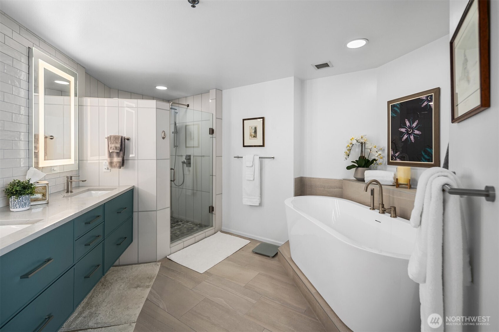 Spacious primary suite in Bellevue Pacific Tower with abundant natural light.