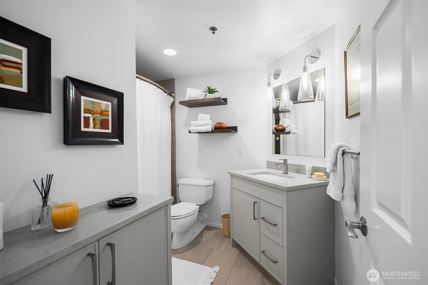 Bright secondary bedroom with comfortable layout in downtown Bellevue condominium.