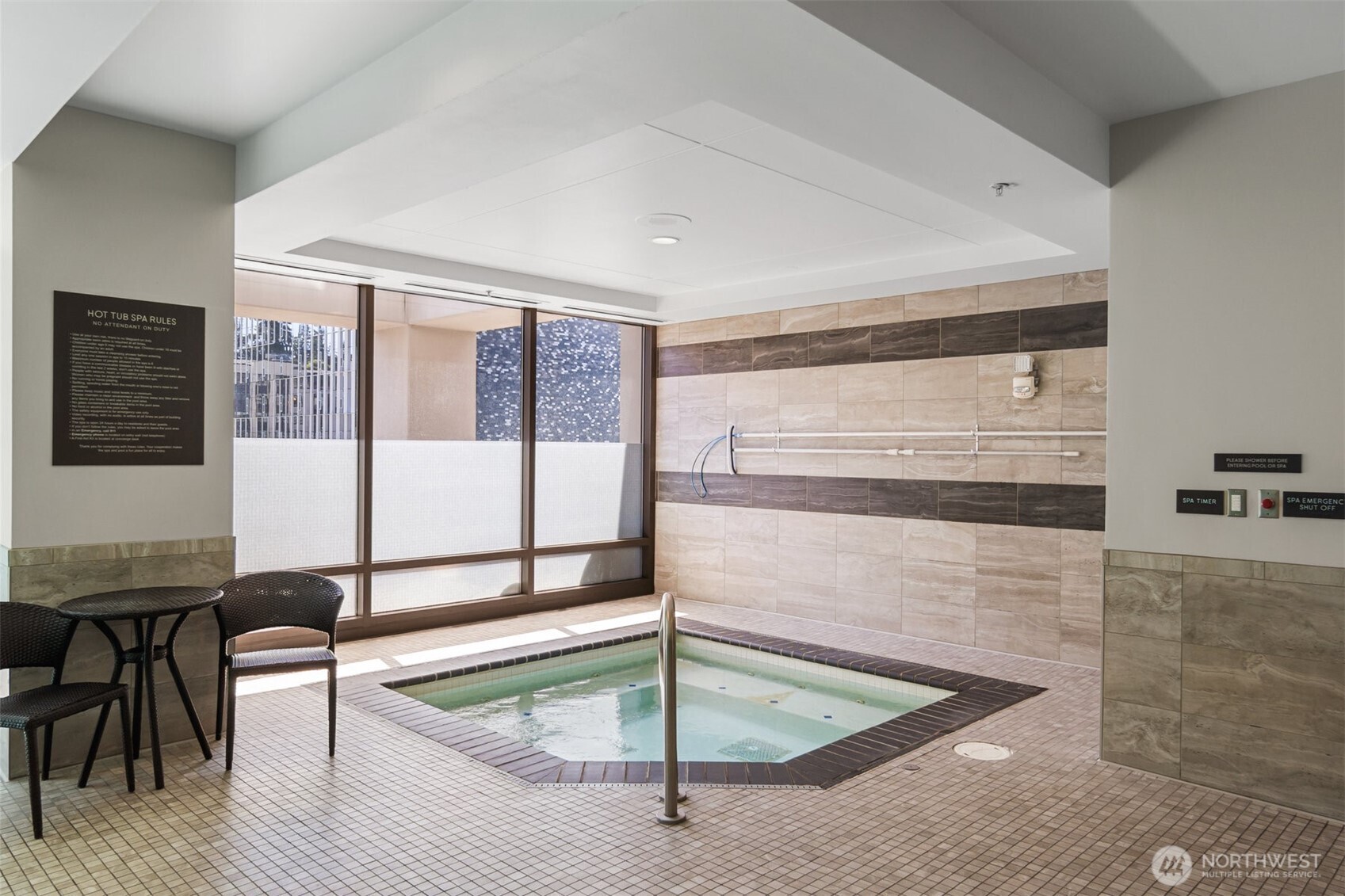 Indoor swimming pool and spa available for Bellevue Pacific Tower residents.