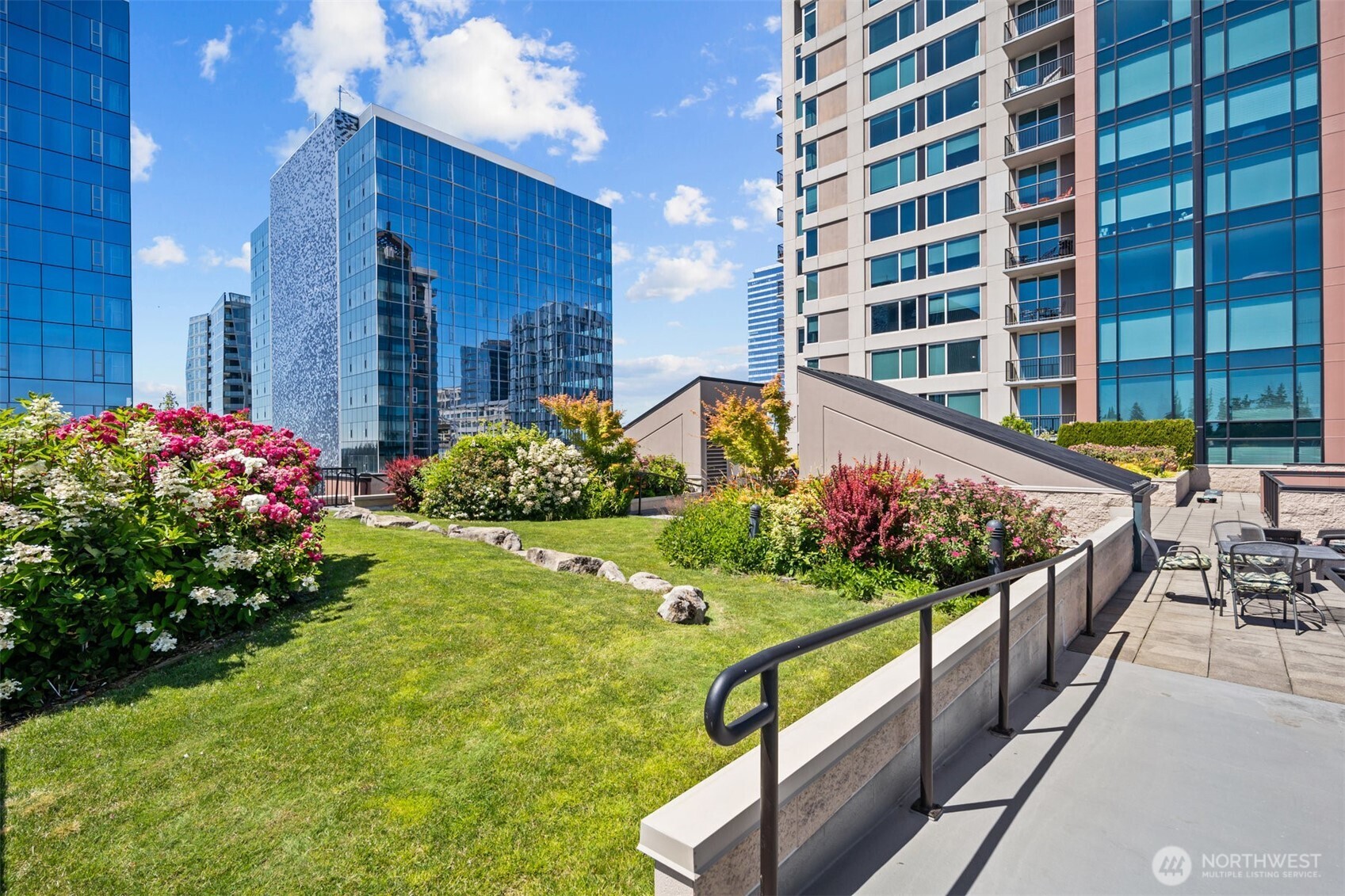 Rooftop terrace with gathering spaces and city views.