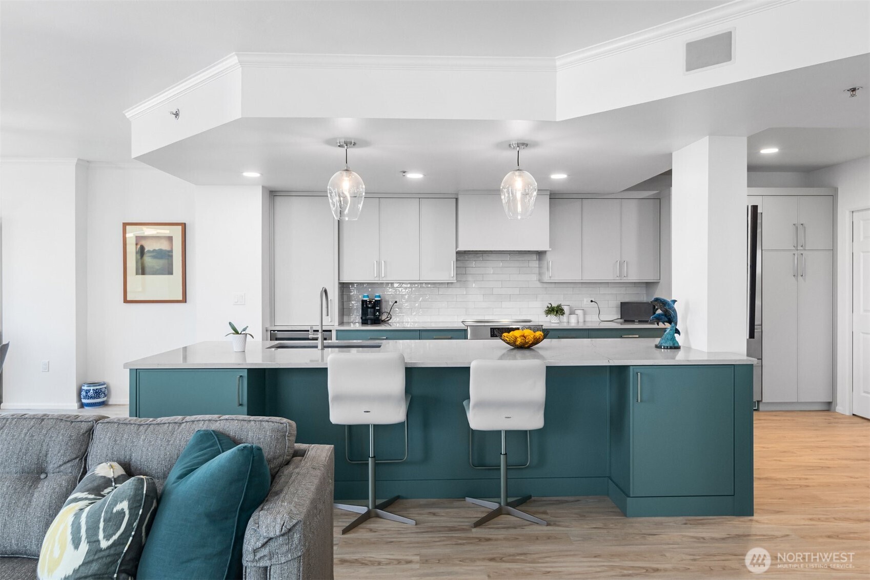 Fully remodeled kitchen with modern cabinetry, premium finishes, and stainless steel appliances.