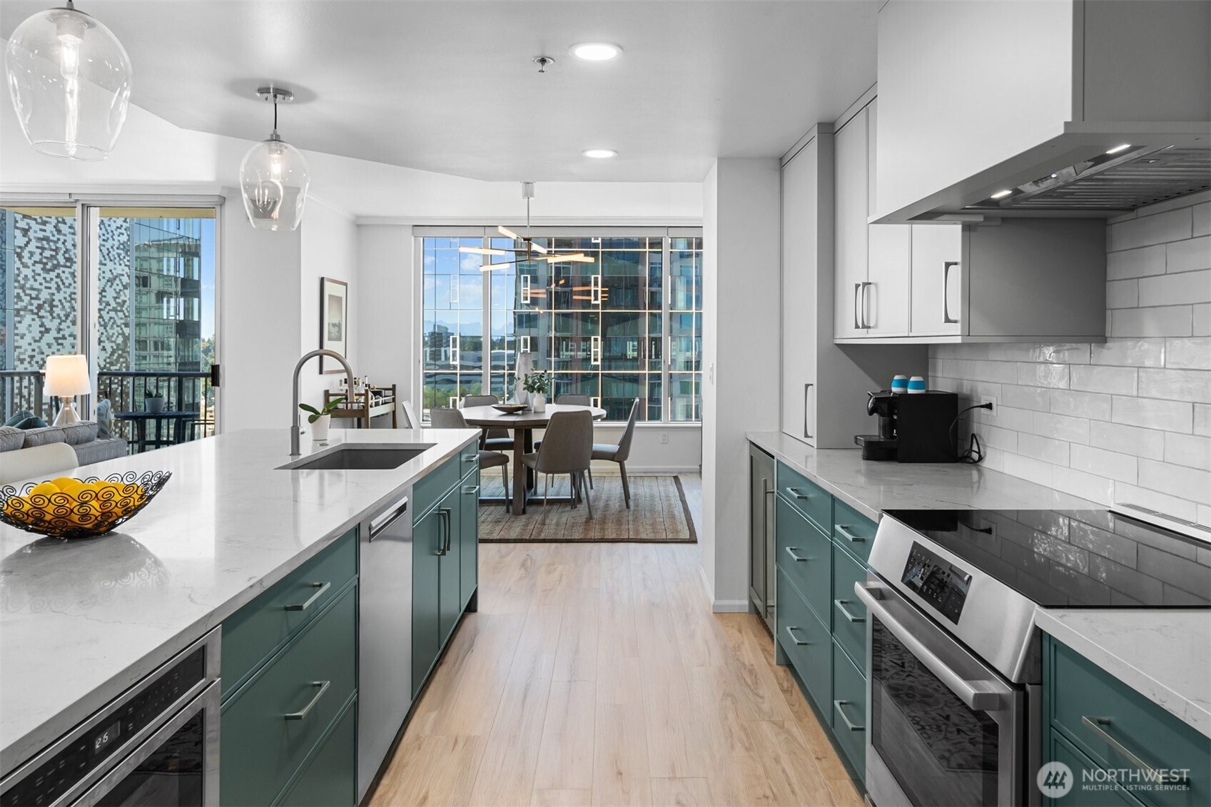 Updated kitchen designed for functionality and style in downtown Bellevue high-rise condo.