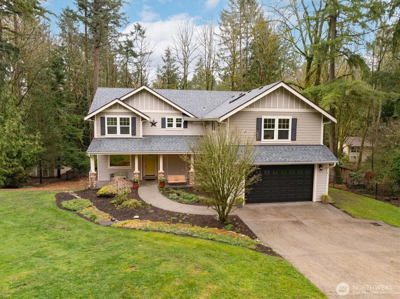 Inviting front door with patio overlooking the flat lawn.