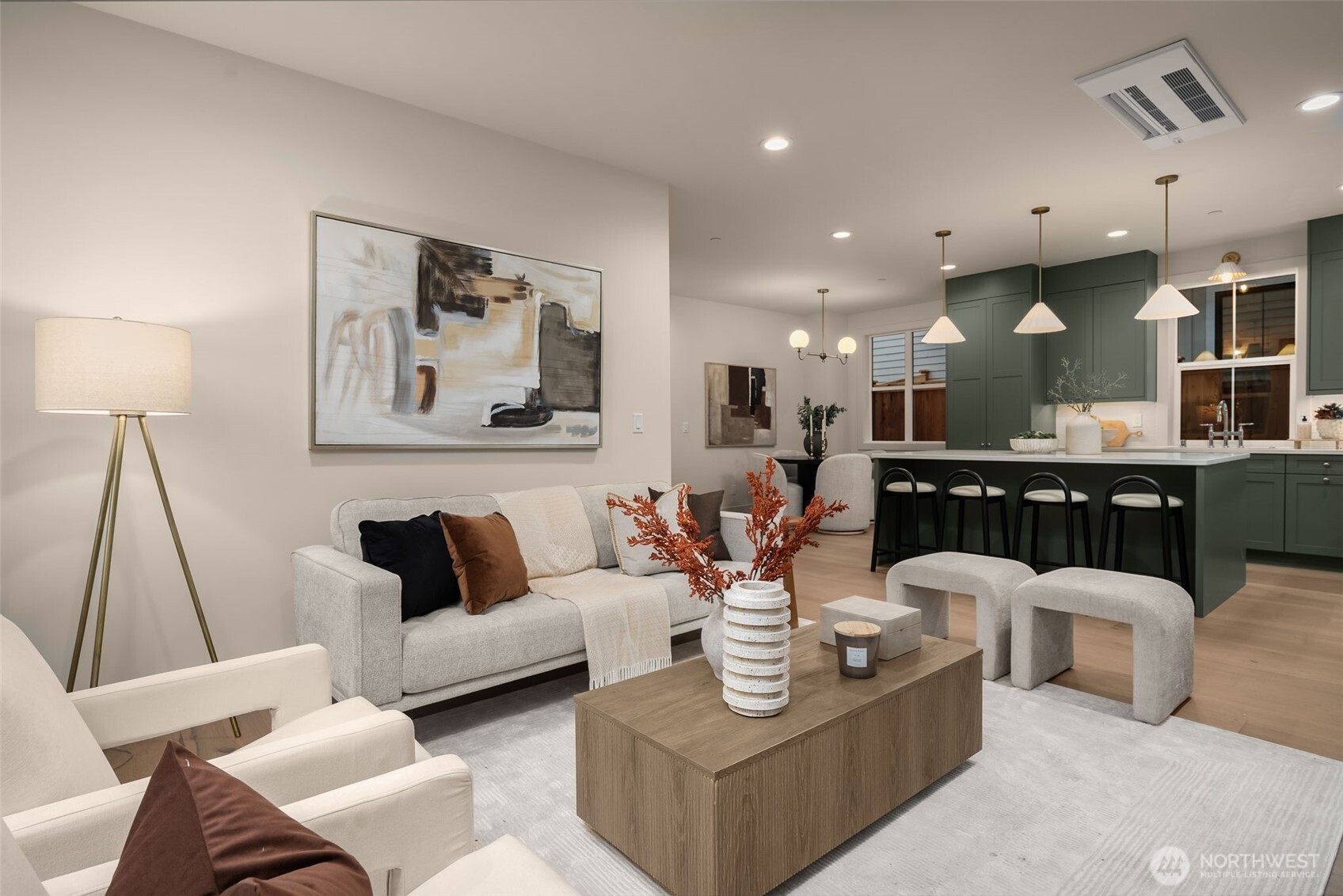 Living room open to kitchen and dining areas.