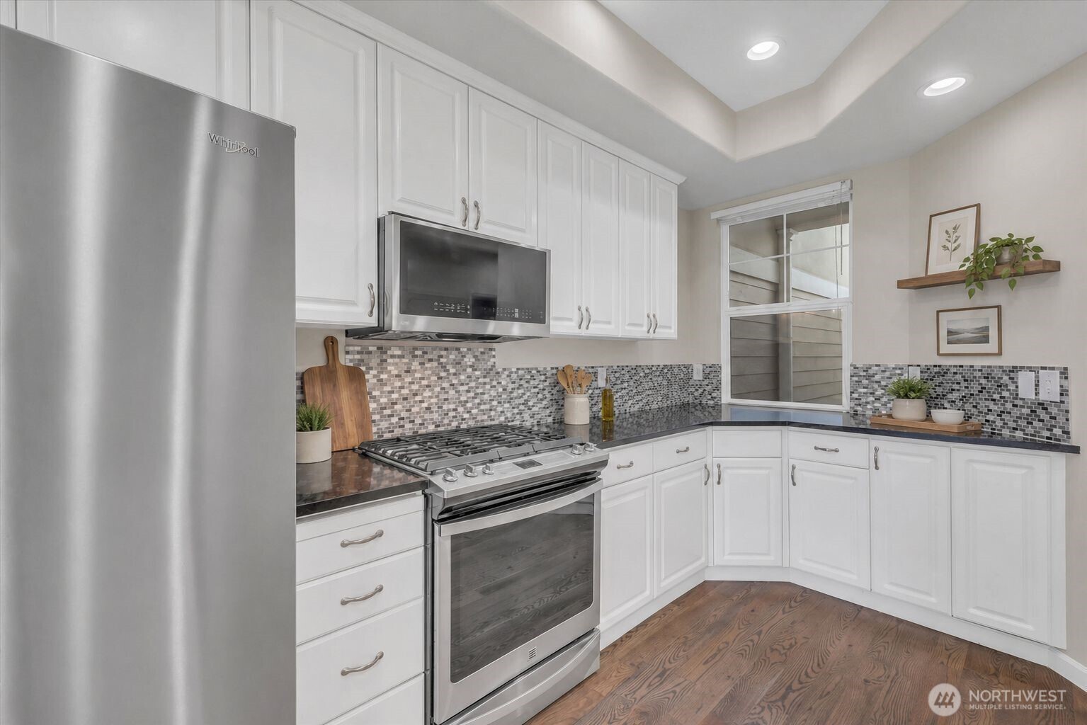 Beautiful kitchen with granite counters and stainless appliances.