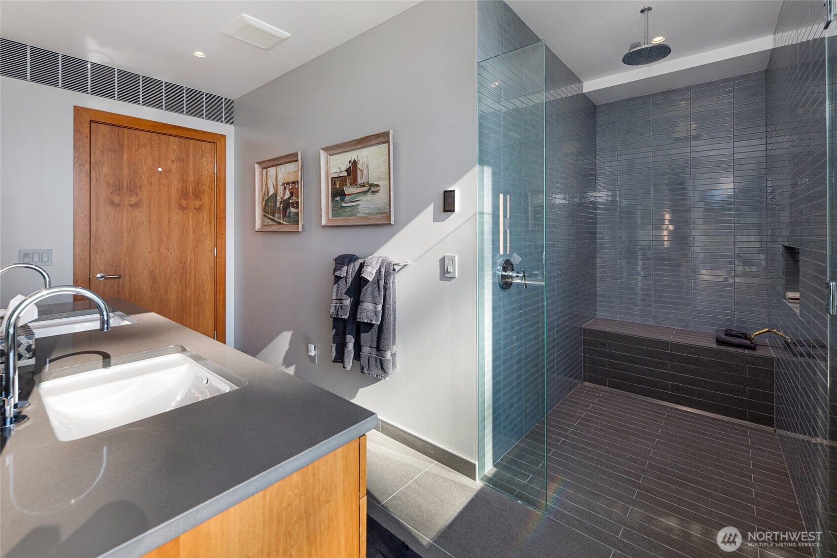 Beautifully appointed bathroom with modern finishes, spacious walk-in shower, and refined design details creating a relaxing spa experience.