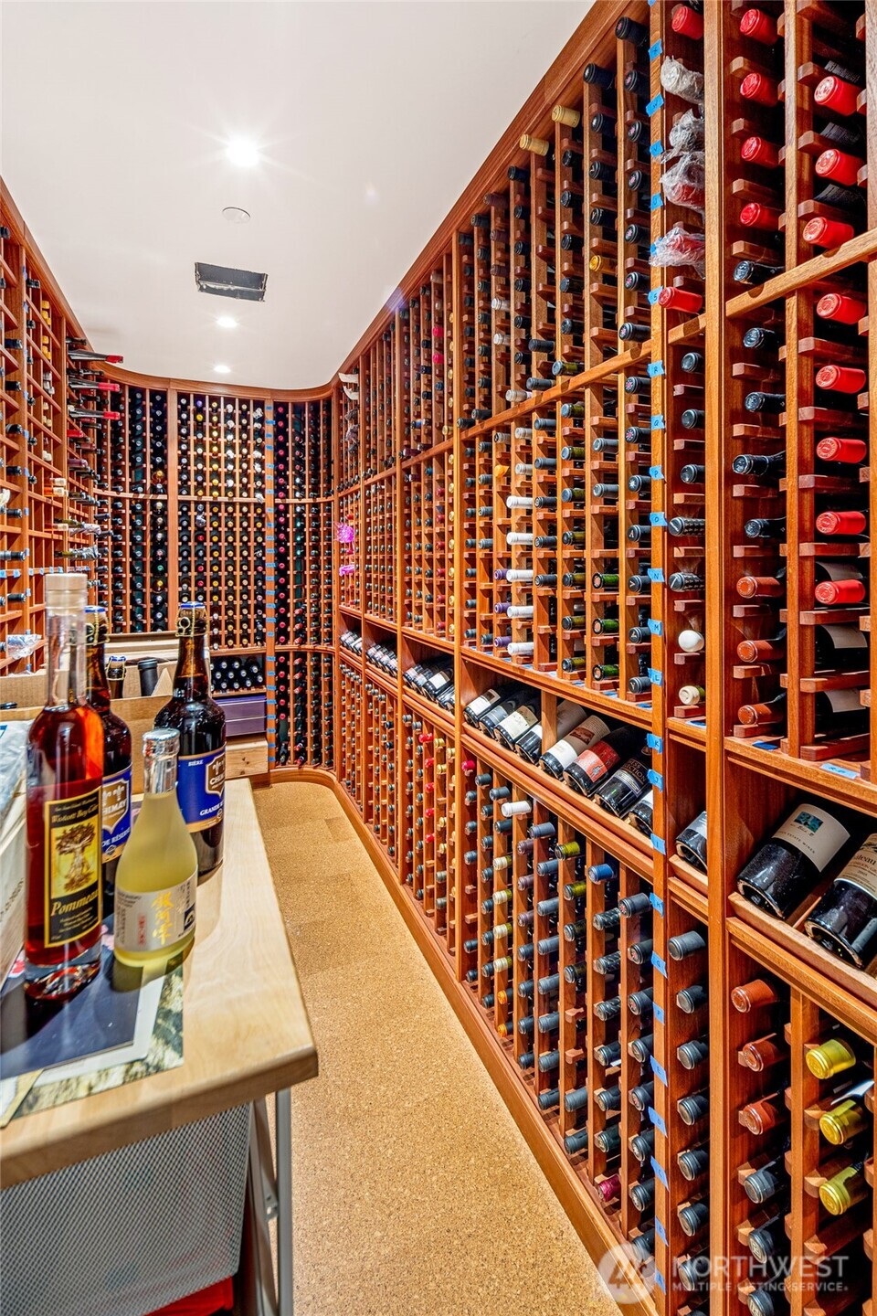 Custom wine cellar with extensive wood racking offers impressive storage for a curated collection—ideal for entertaining and wine enthusiasts alike.